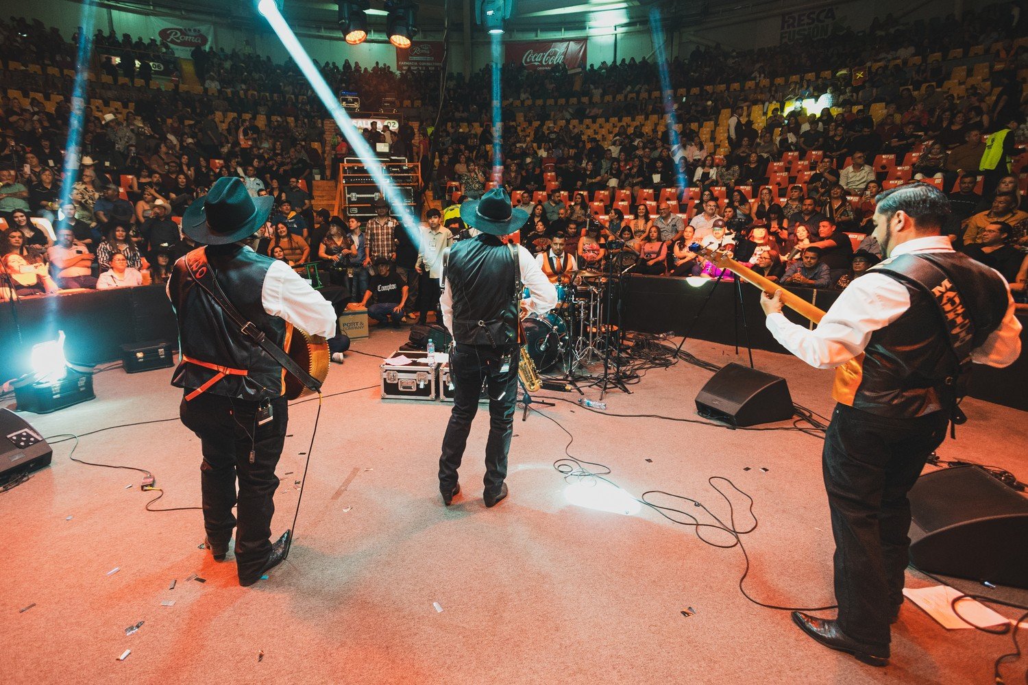 Grupo Silverado and its audience at the rodeo arena, 2026